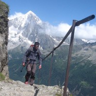 hiker with Mont Blanc behind - Trekking the TMB’s southern half