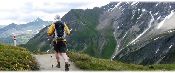 Hiker entering Switzerland from Italy - Fine walks in the Alps
